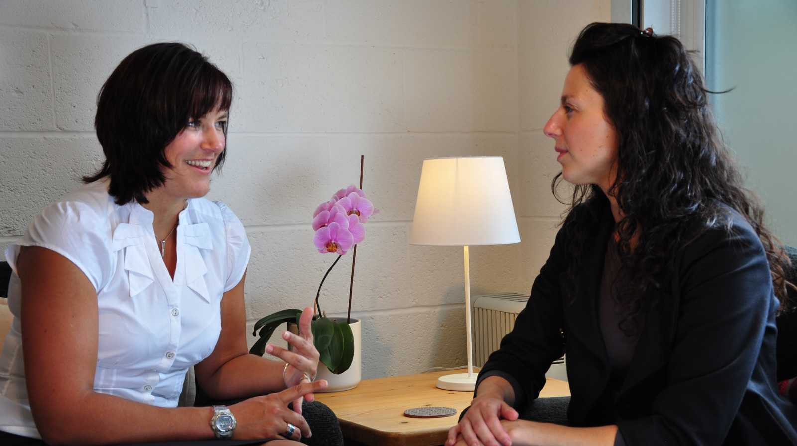 Liz Turnbull giving financial advice to a female client